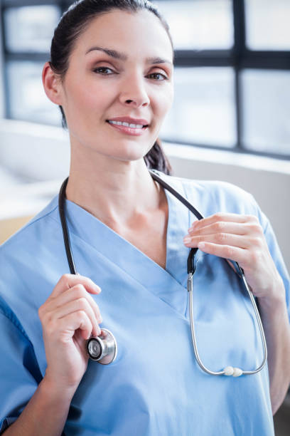 istock Nurse smiling at the camera 802833336