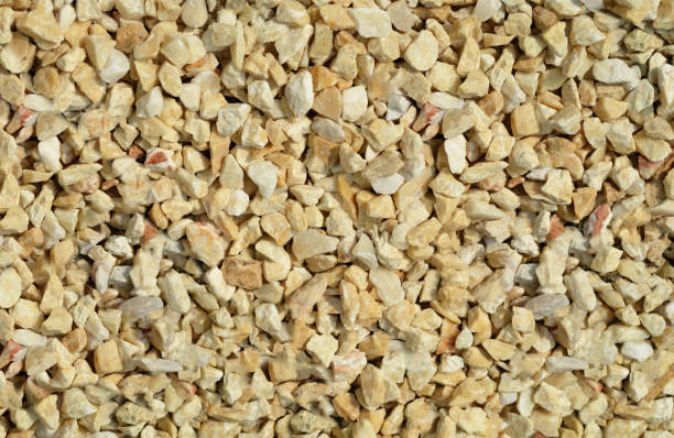istock Yellow and white Pebbles, crushed stone decorate texture  background 802843218