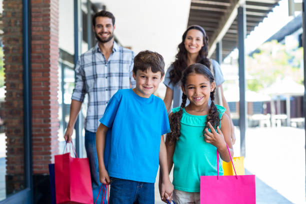 istock Happy family having fun in the mall 802843500