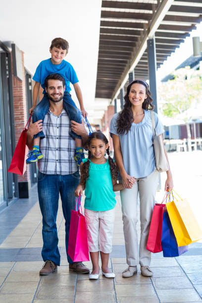 istock Happy family having fun in the mall 802843518