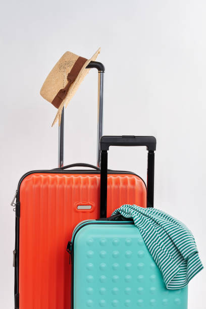 istock Suitcases and clothes for journey. 802843748