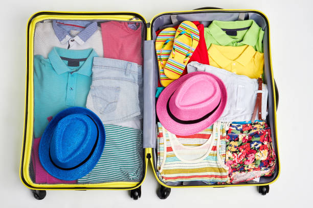 istock Woven hats and clothing in suitcase. 802851540