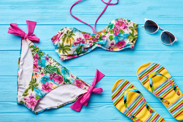istock Colorful swimsuit, glasses, sandals. 802852330