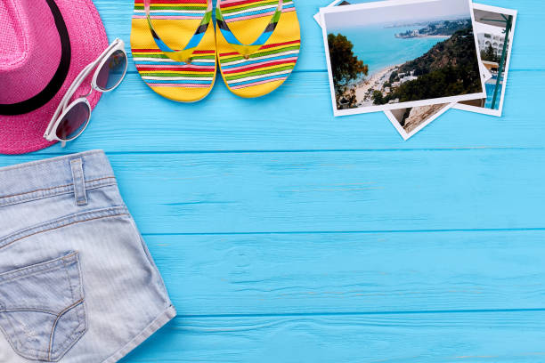istock Summer clothing on blue floor. 802857566