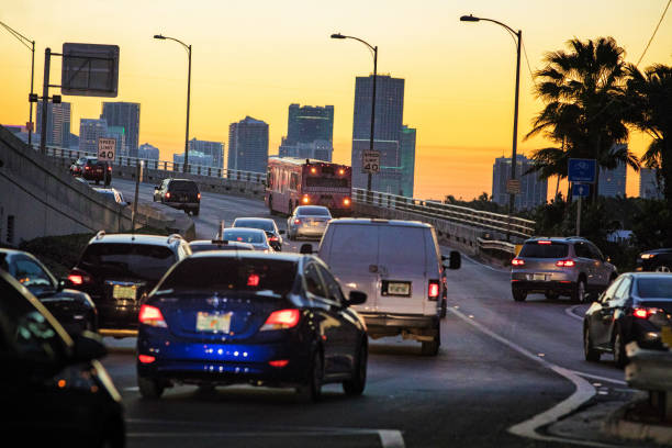 Evening traffic crossing Biscayne bay towards downtown Miami at sunset