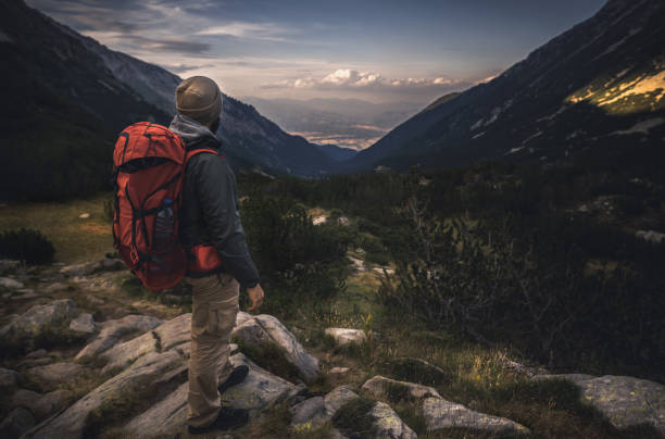 istock Traveler watching the sunset over the mountains 802862828