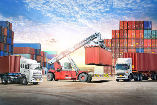istock Logistics import export background and transport industry of forklift handling container box loading at seaport 802870536