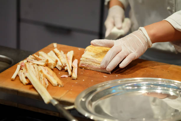 istock The chef's hands are making ham cheese sandwiches. 802884858