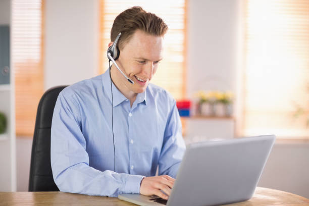 istock Casual businessman using headset on a call 802885966