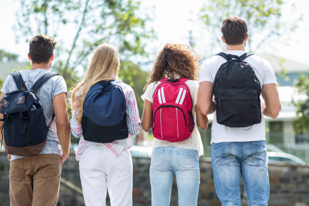 istock Rear view of hip friends with backpacks 802886278
