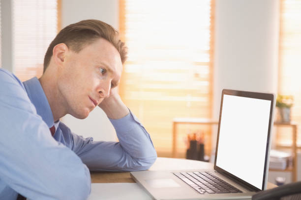 istock Focused businessman looking at laptop 802899526