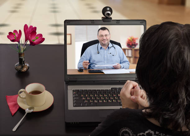 Anytime woman can contact her doctor via internet stock photo