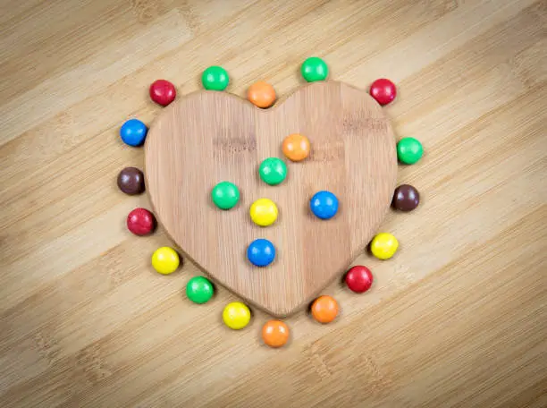 Delicious homemade  cookie with colorful chocolate sweets inside a sweet heart