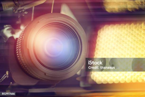 Professional Video Camcorder In Studio With Blurred Spot Light Background Stock Photo - Download Image Now