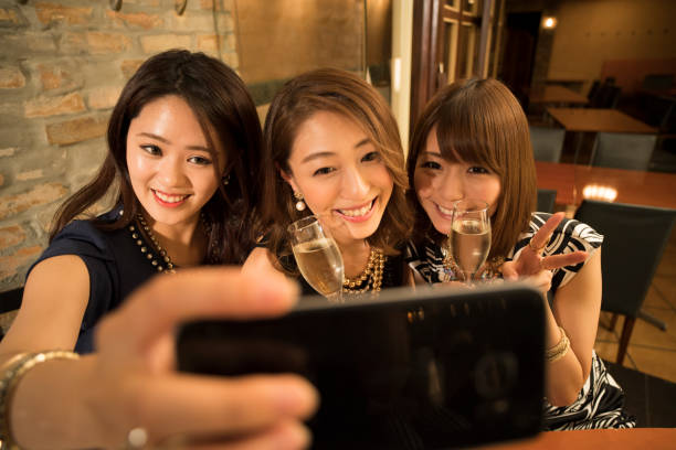 istock A female college student who uses her smartphone to take self-taking. 802918062