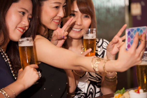 istock Female college student taking self photos with smartphone. 802920920