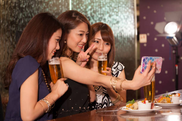 istock Female college student taking self photos with smartphone. 802920956