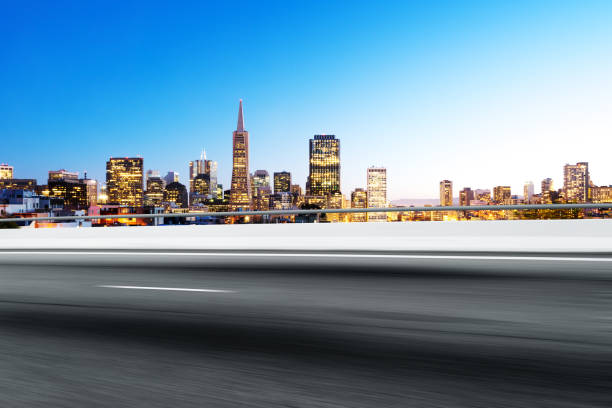 istock empty road with cityscape of modern city 802920986
