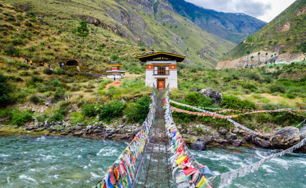 Iron Chain Bridge of Tachog Lhakhang Monastery, Paro River, Bhutan Iron Chain Bridge of Tachog Lhakhang Monastery, Paro River, Bhutan bhutan stock pictures, royalty-free photos & images