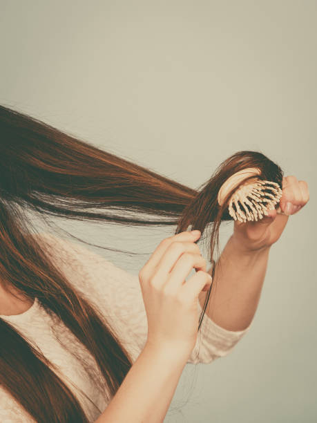 istock Happy woman brushing her hair 802929496