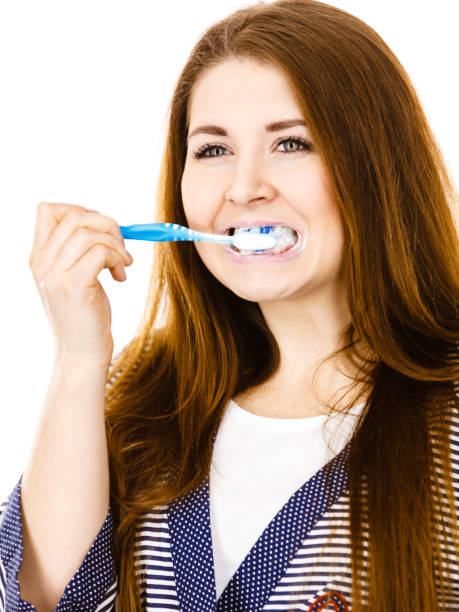 istock Woman brushing cleaning teeth. 802938150