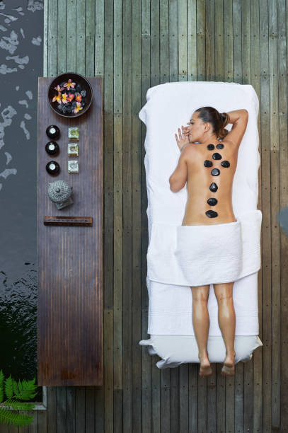 istock asian back massage theraphy spa hot stone 802943974