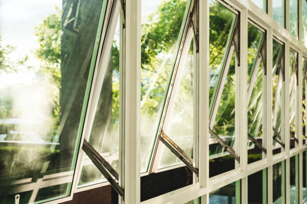 istock Modern office building wall and opened window in the morning 802944502