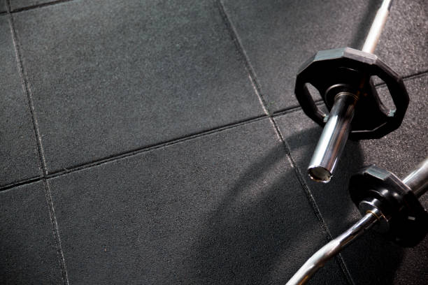 istock Two different barbell on the floor in the Gym 802946980