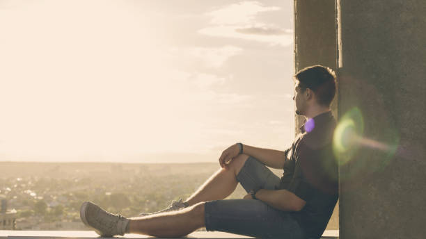 istock Lone roofer on roof at sunset 802947320
