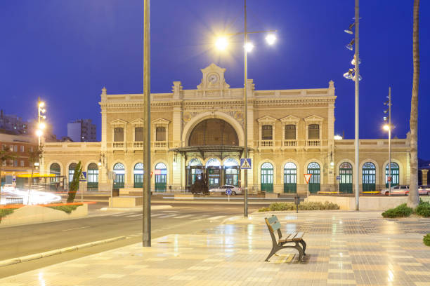 The central station in the city of Cartagena illuminated at night. Region of Murcia, Spain