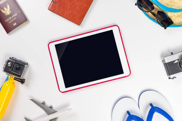 istock Blank tablet screen surrounded by summer beach travel accessories 802952958