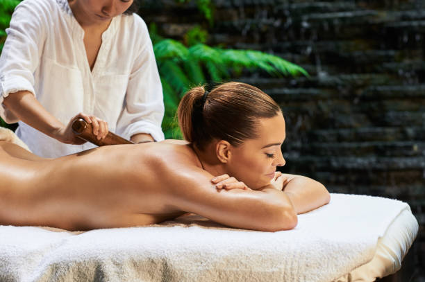 istock asian back massage theraphy spa hot stone 802953354