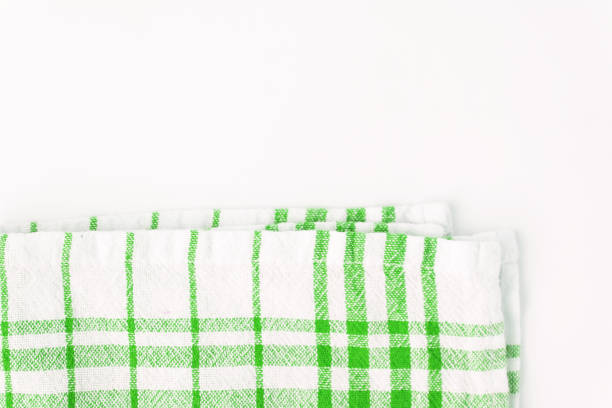 istock Green cloth, a kitchen towel with a checkered pattern, on a white background isolated 802967280