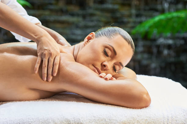 istock asian back massage theraphy spa hot stone 802970374