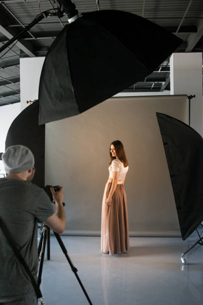 istock Photographer and happy model at studio session 802975728