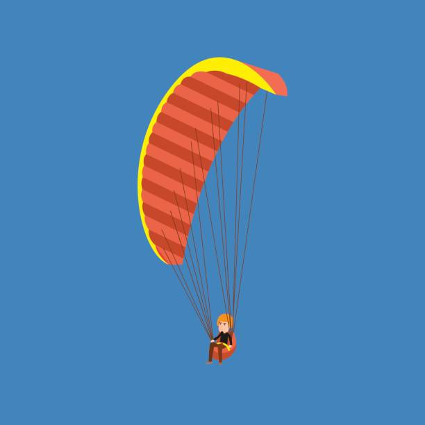istock Man paragliding on a parachute. Parachutist descending with a parachute 802977780