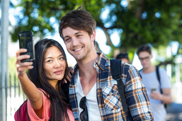 istock Cute couple taking selfie 802978118