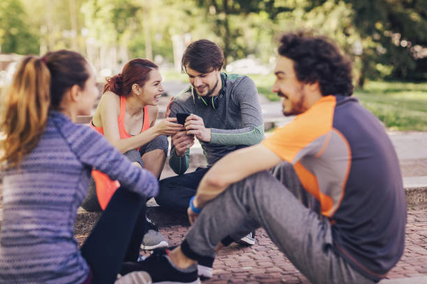 istock Sports persons with mobile phone 802984140