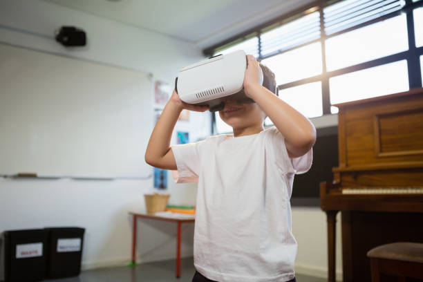 istock Close of boy holding virtual reality simulator 802986364
