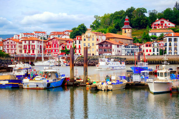 Colorful basque houses in port of Saint-Jean-de-Luz, France Traditional half-timbered basque houses in port of St Jean de Luz, on the atlantic coast of France french basque country photos stock pictures, royalty-free photos & images