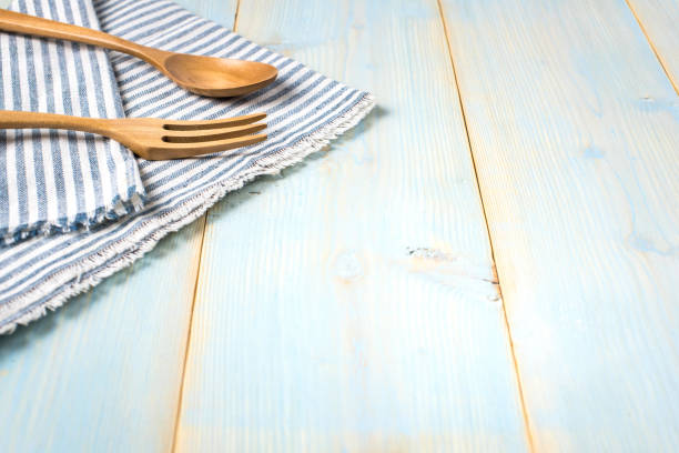 istock Empty wood plate, fork, spoon,tablecloth on  wood table, top view, background, template, food display montage,free space for text 802991556
