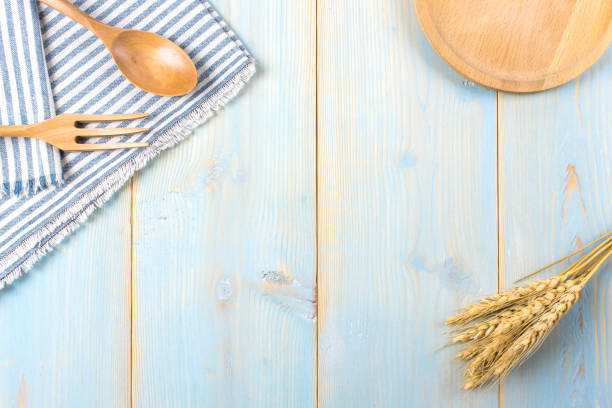 istock Empty wood plate, fork, spoon,tablecloth on  wood table, top view, background, template, food display montage,free space for text 802992826