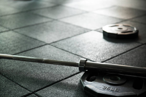 istock Close up barbell on the floor in the gym 803000990