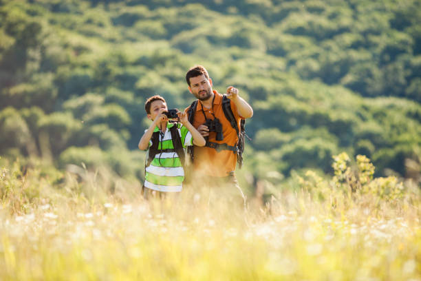 istock Father and son hiking 803001546