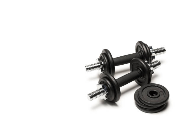 istock black iron dumbbells with weight plates isolated on white 803004384