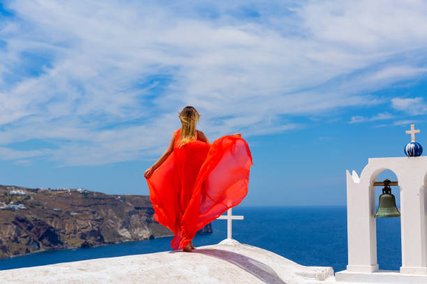 istock Young woman in red dress 803013306