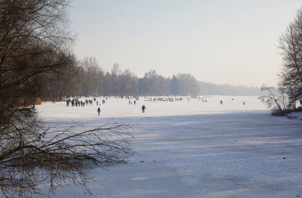 Winter fun on ice on a frozen lake, Augsburg, Bavaria, Germany,