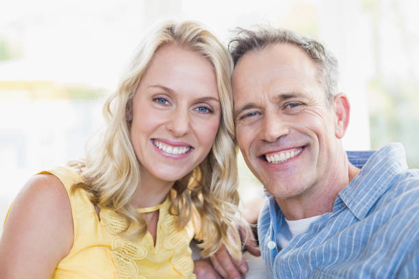 istock Happy couple smiling at camera 803040028