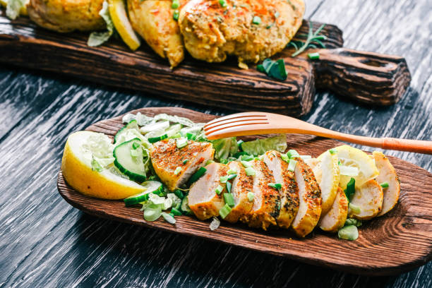 Roasted chicken breast on rustic wood