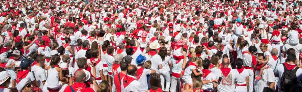 Photo of Crowd of people dressed in white and red at the Summer festival of Bayonne (Fetes de Bayonne), France